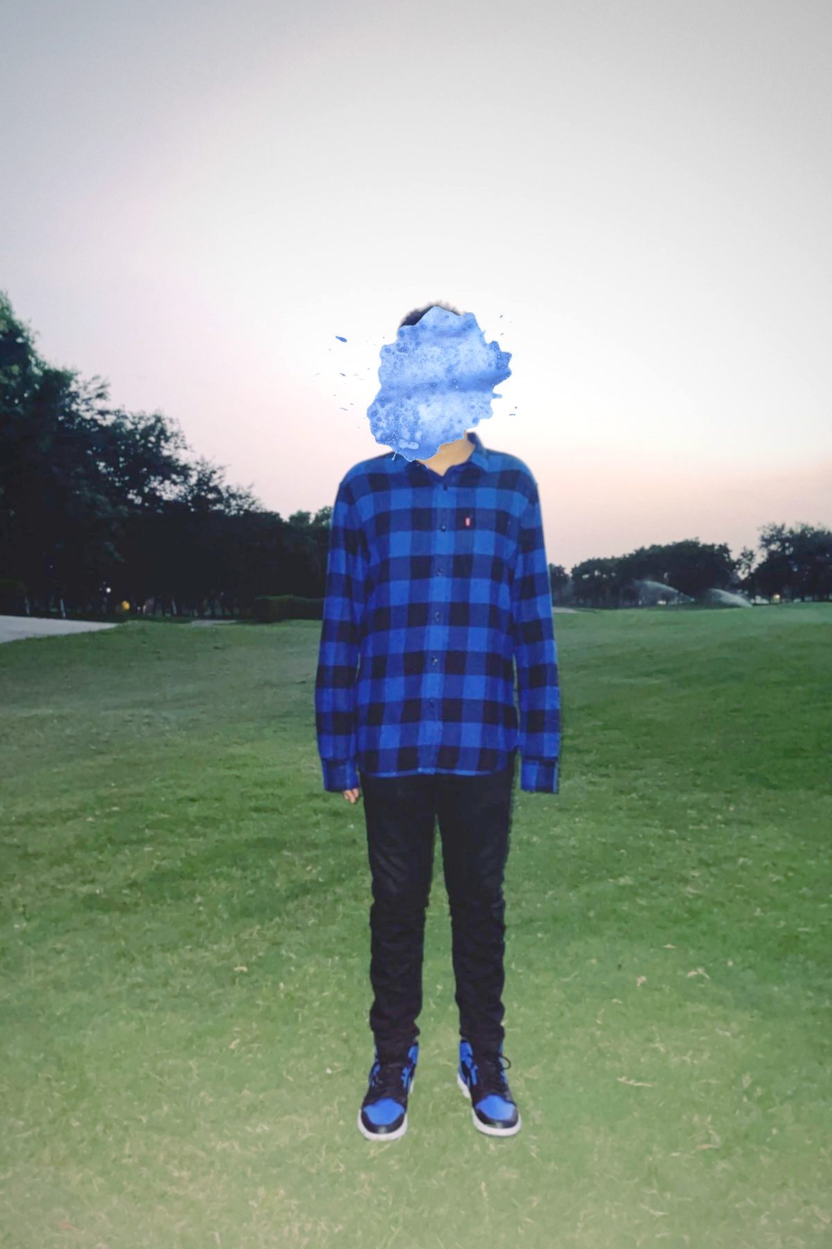Harsh on a golf course at dusk, face painted over